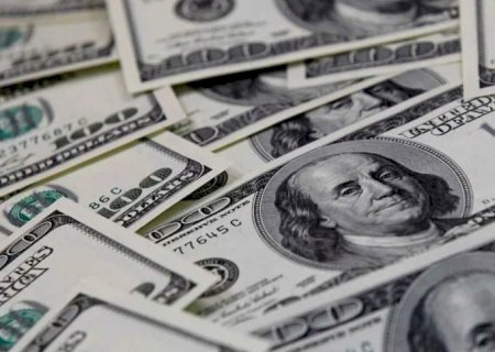 Dólar encerra sessão em queda e fecha a R$ 5,13